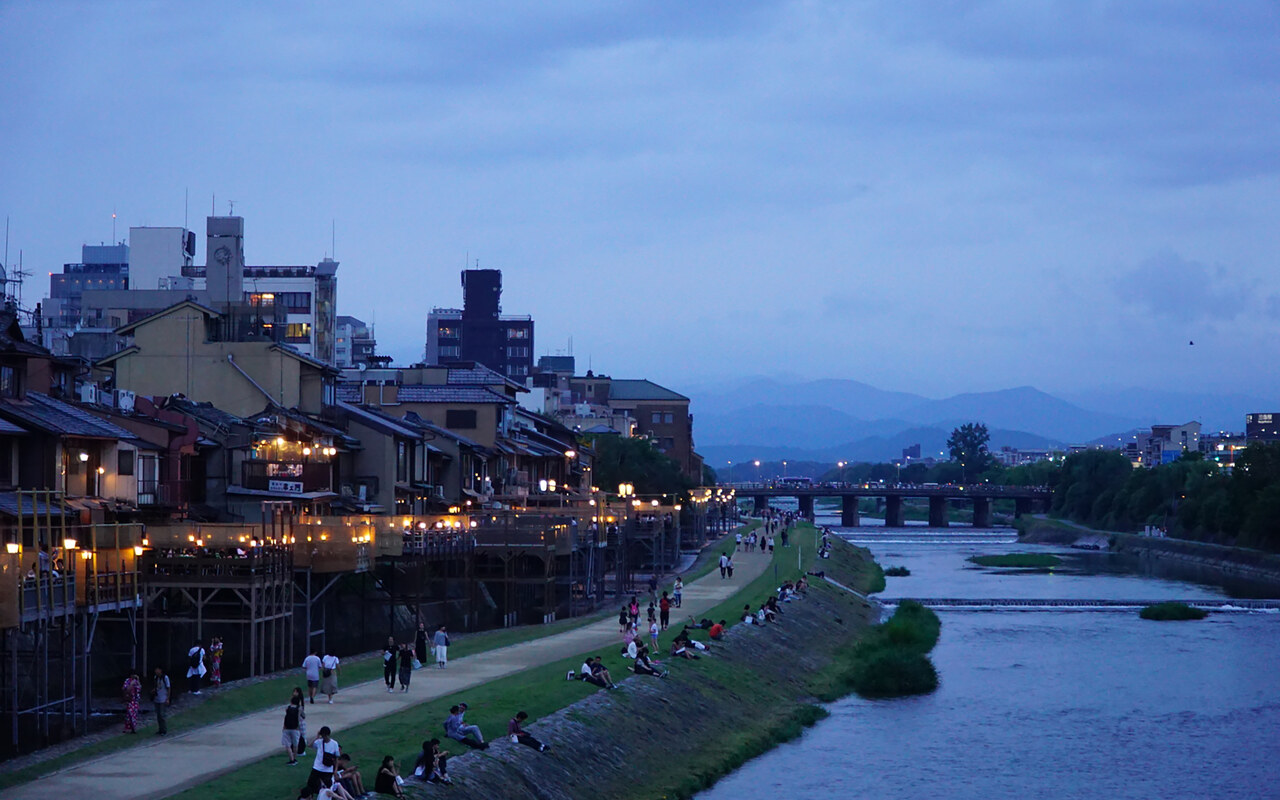 Kyoto's riverside restaurants and lanterns at dusk